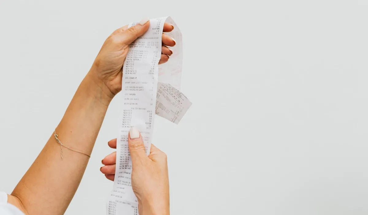 A long till receipt curling off a table