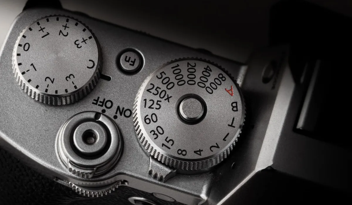 Illustration of a hand turning a dial between two labels-free positions
