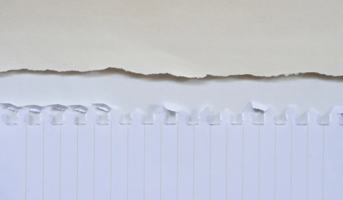 Two stacks of paper, one tall and one short, side by side